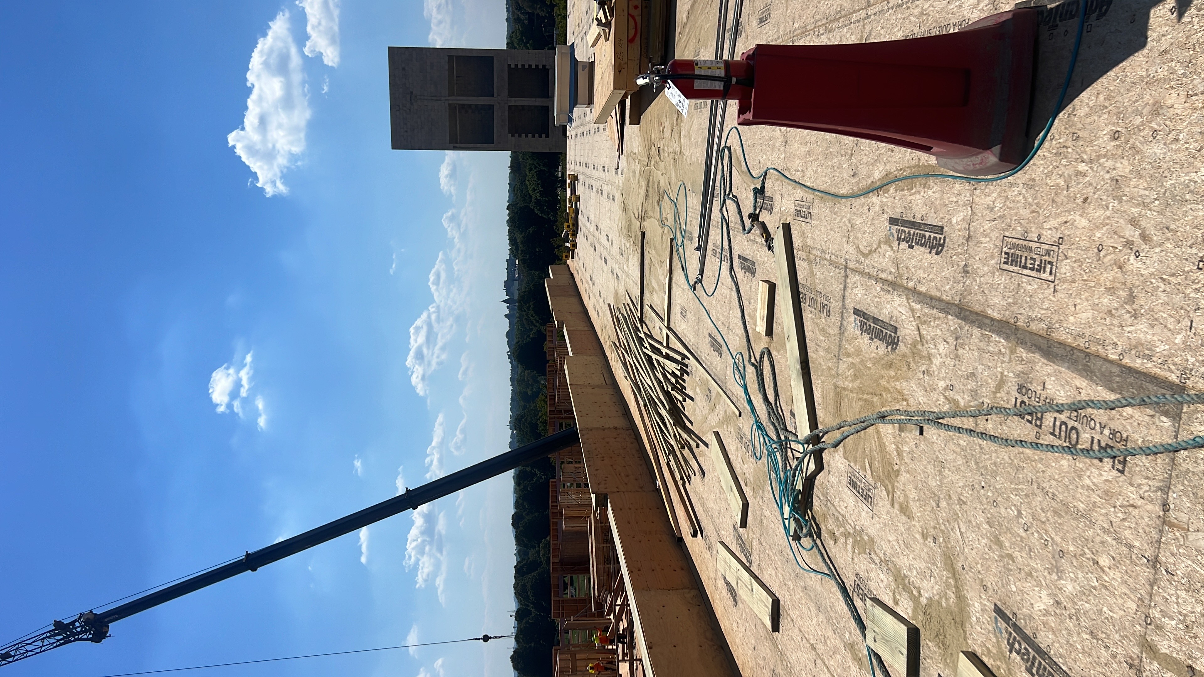Rooftop Construction - Mass Timber Building with Crane Operations