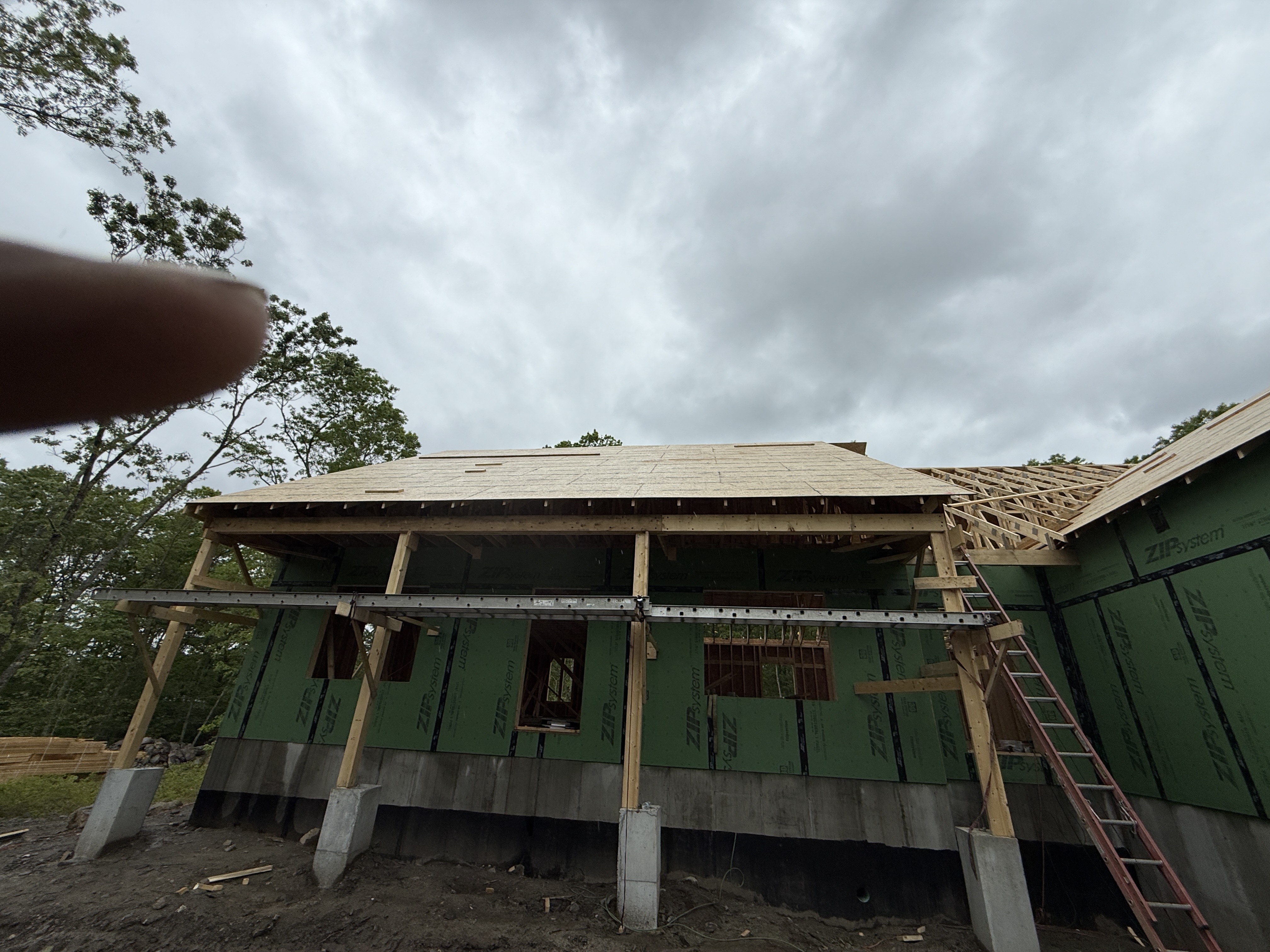 Wide View Construction Site - Foundation and Roof Framing Stage