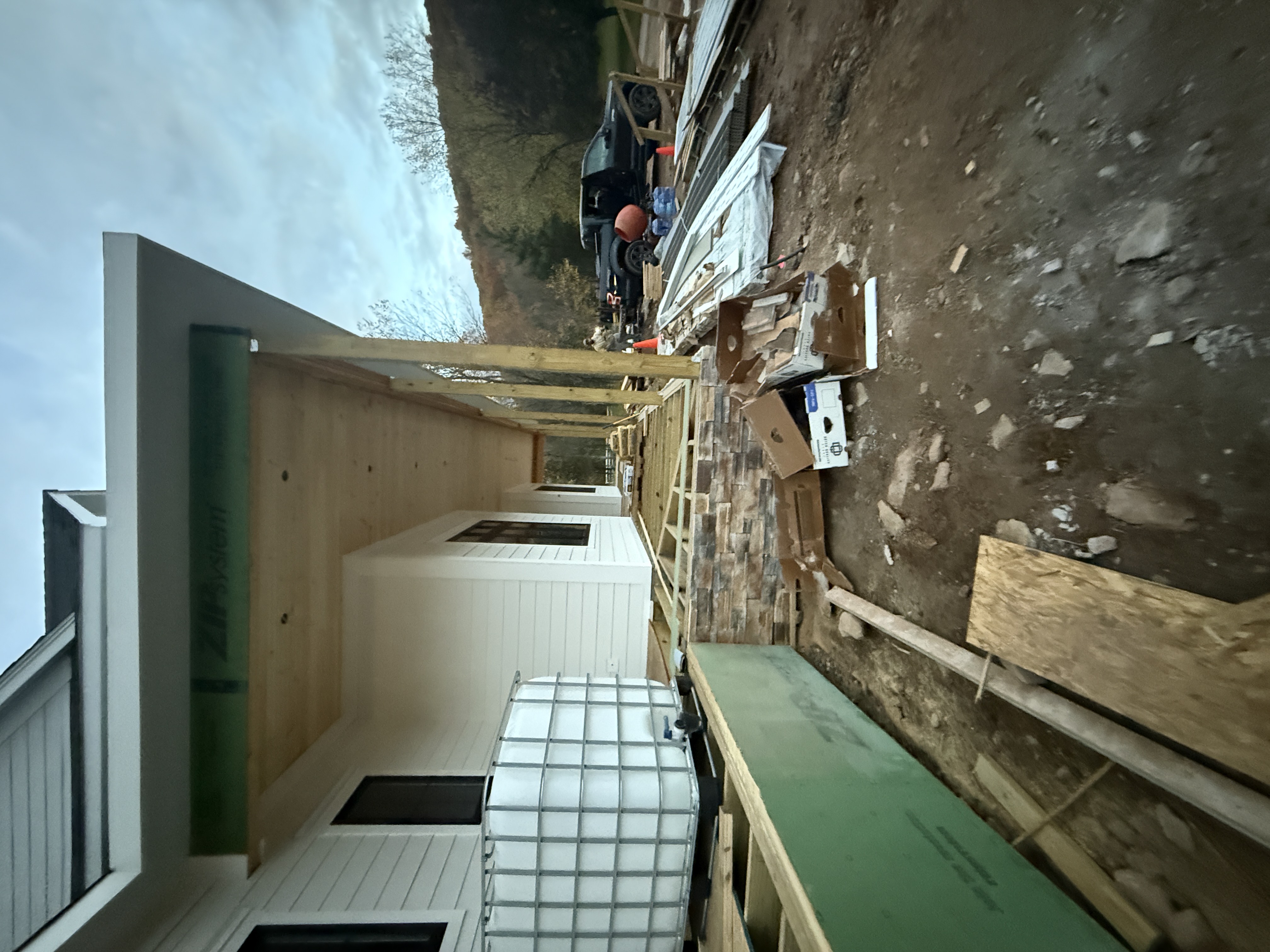 Covered Porch Framing - Deck Construction with Stone Veneer Base