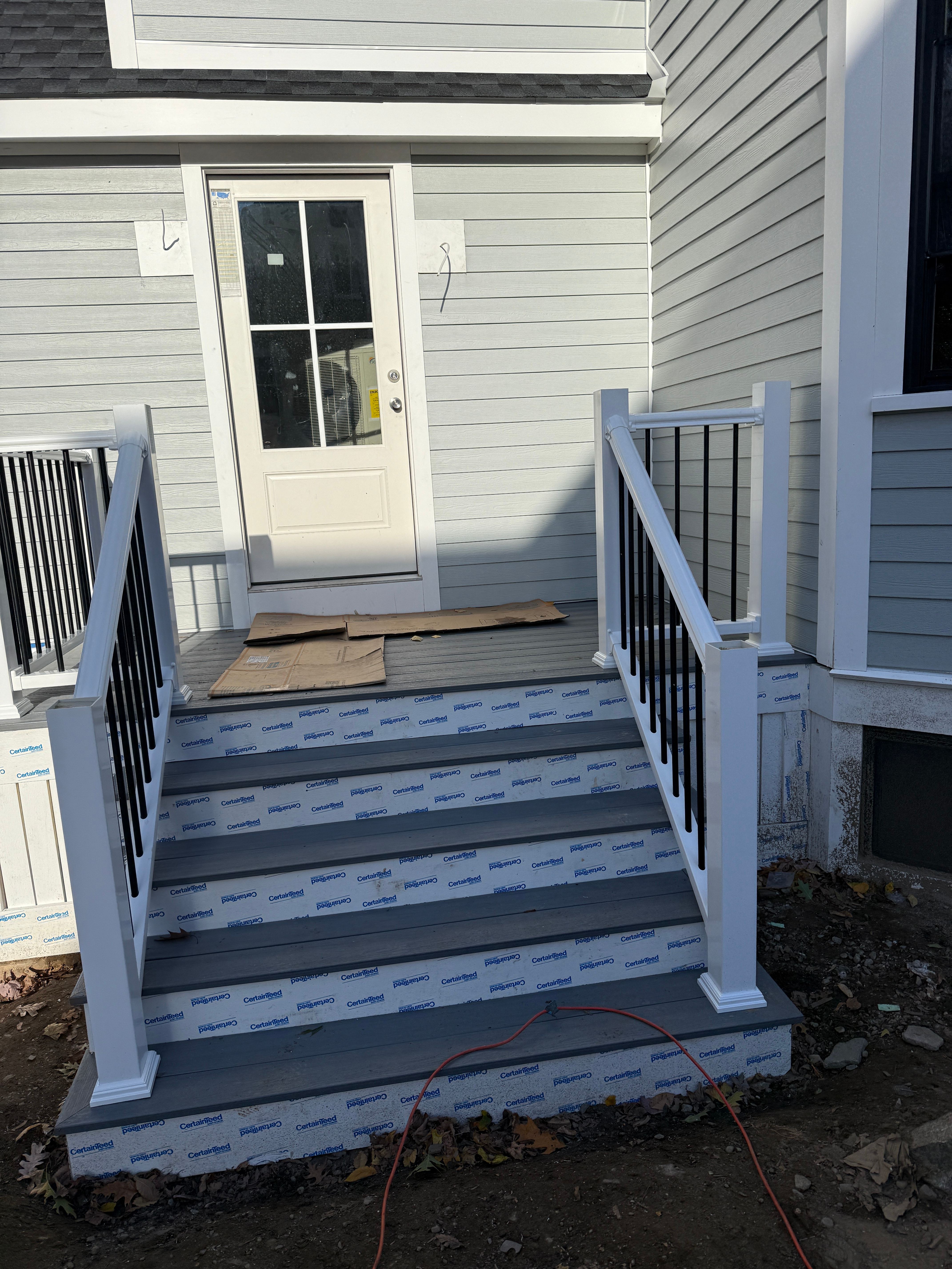 Composite Deck Entry - Gray Decking with White Posts and Black Railings