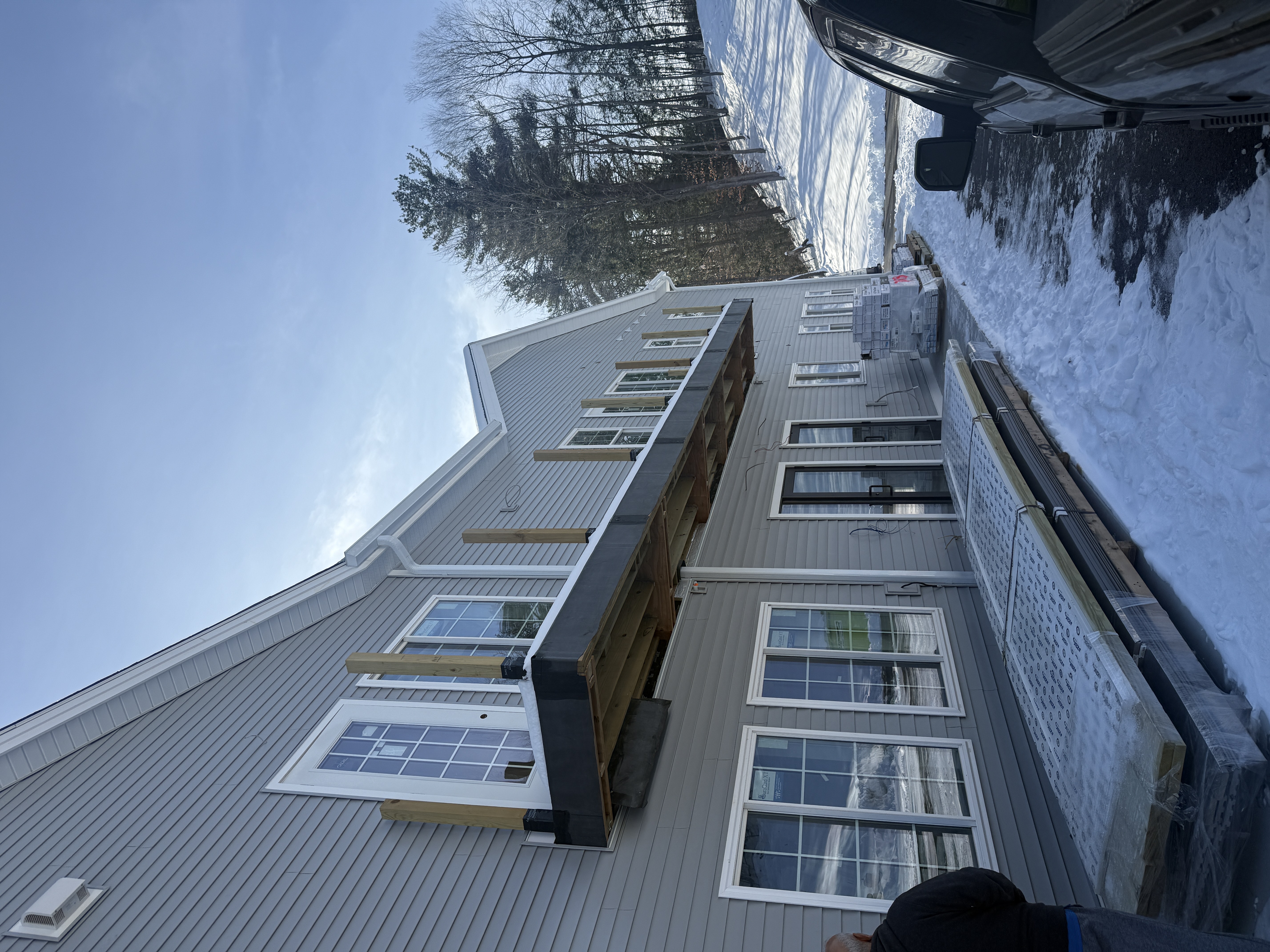 Two-Story Home Addition - Custom Siding and Window Installation